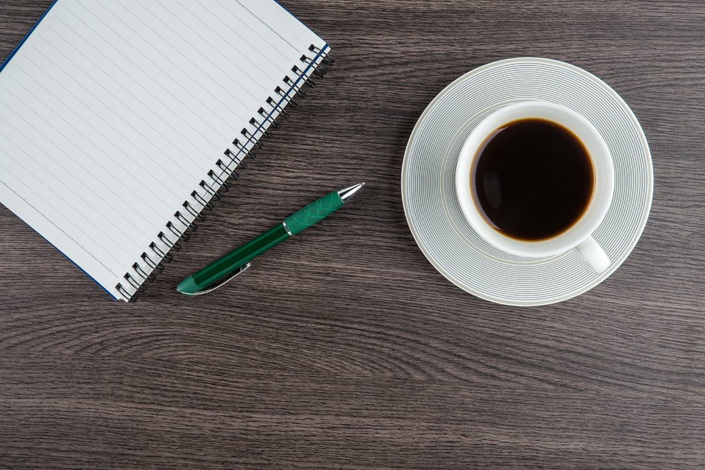 Notebook with pen and cup of coffee, Planning